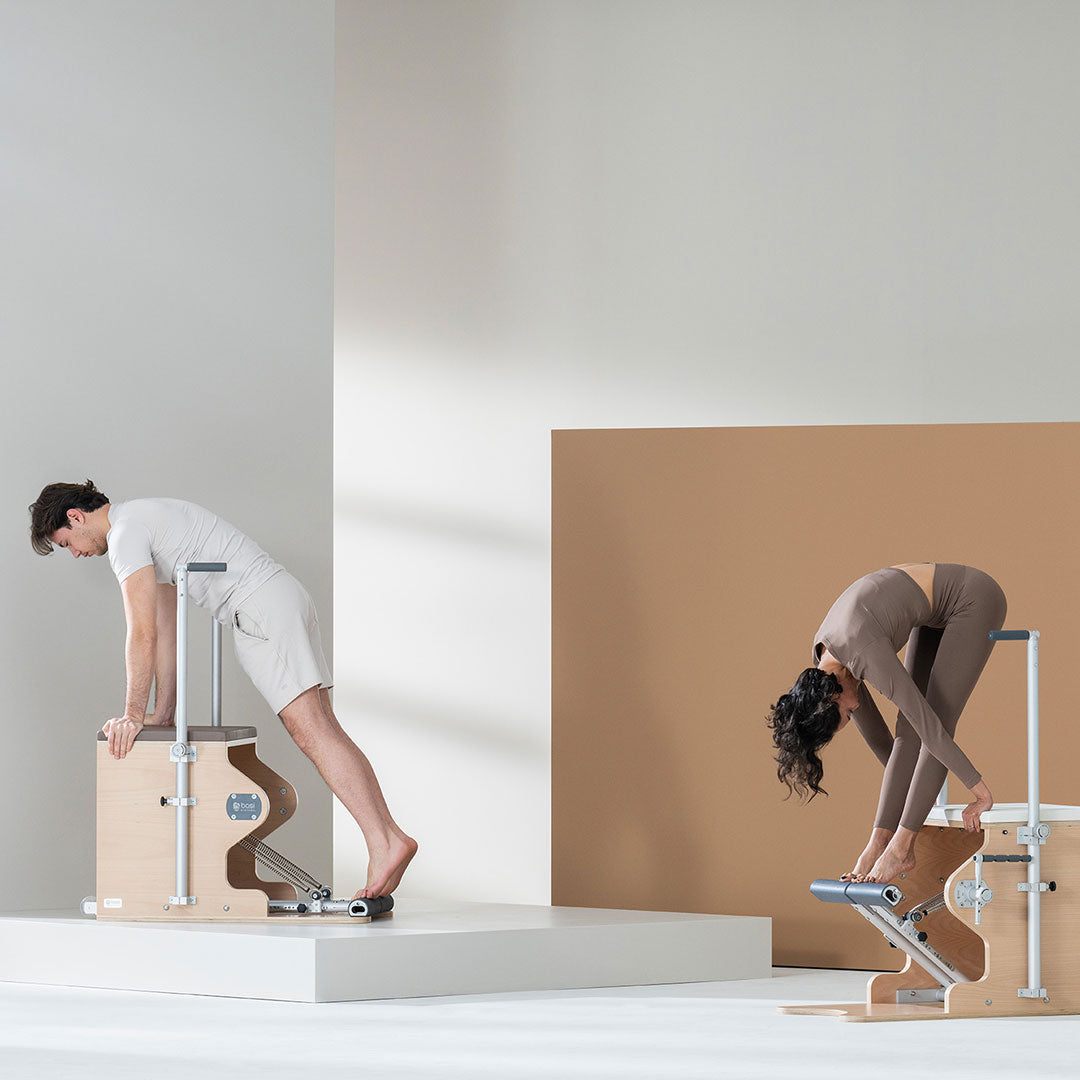 People practicing Pilates on a BASI Wunda Chair