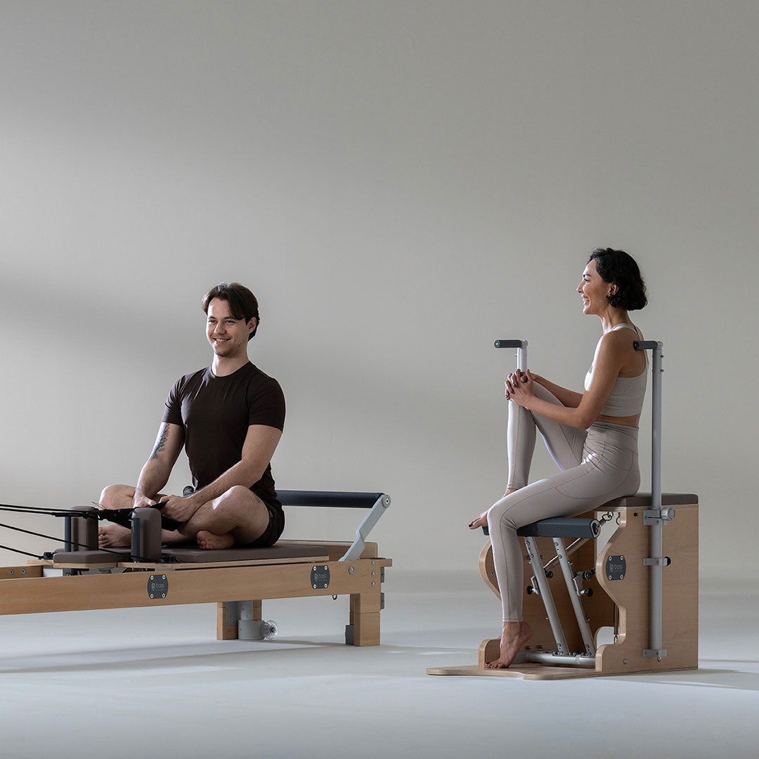 People on a pilate reformer and BASI Wunda Chair